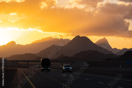 Tabuk, Saudi Arabia: Dramatic sunset over the road in the desert near Tabuk in the Northwest part of the country.