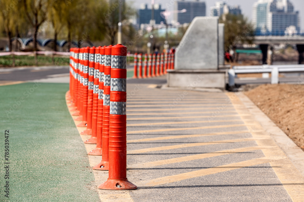 View of the red fence on the road in the park
