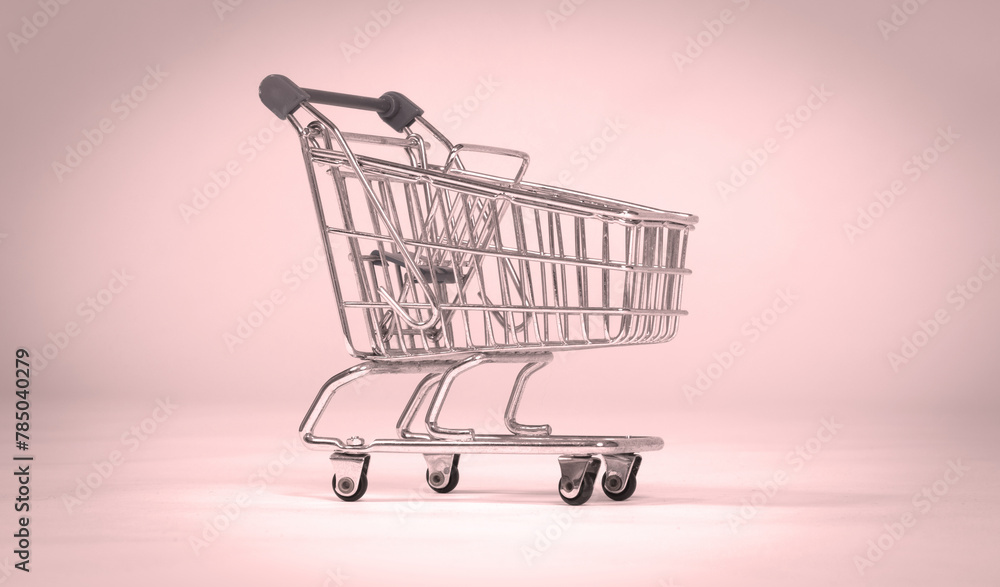 Small shopping cart isolated on solid background