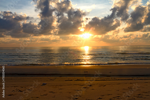 Sunrise on water in morning  at beach