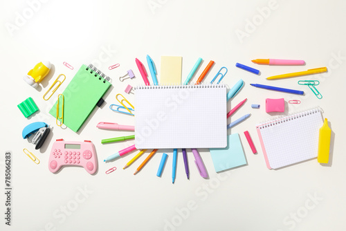 Notebook and stationery on the table, top view.