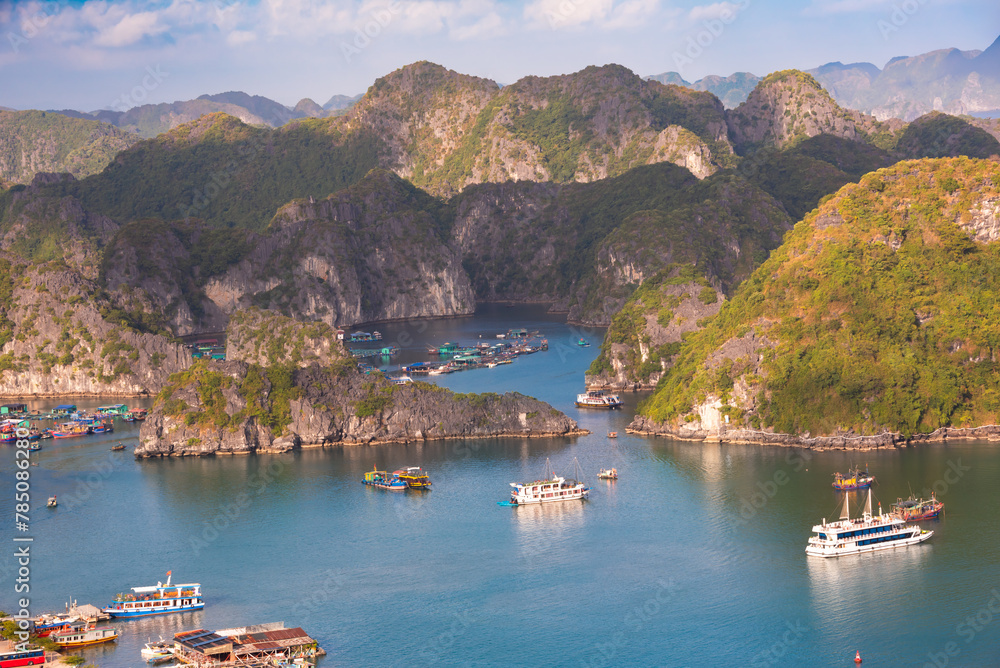 Fototapeta premium Sea landscape in Vietnam with many small islands and boats. View from above