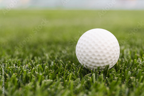 Game ball for playing golf on green grass