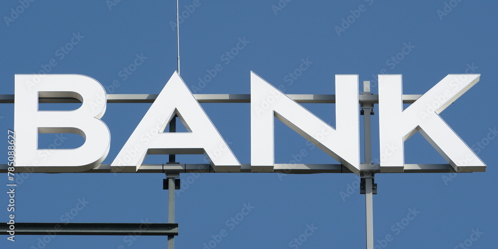 Universal bank banner isolated on sky blue background. Money, finance and bank sector concept. Universal bank banner isolated on sky blue background. Money, finance and bank sector concept.
