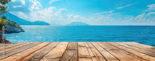 Tranquil scenery of a sparkling blue sea from a warm wooden dock, showing a clear sky, lush green trees, and distant ocean islands. copy space for text. banner.