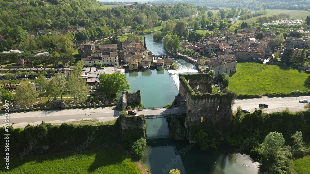 Beautiful panoramic aerial view of the mill village of Borghetto sul Mincio in the south of Lake Garda, in Veneto, Italy. Tourism and travel concept