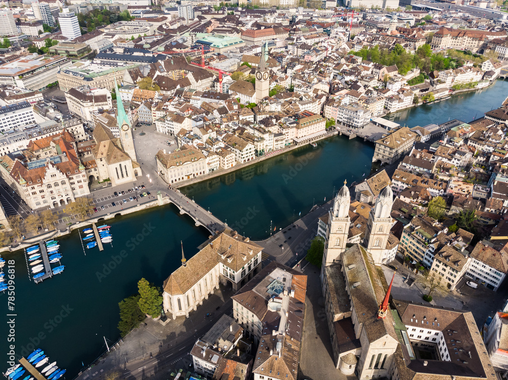 Zurich, Switzerland: Aerial drone view of the Grossmunster cathedral along the Limmat river in Zurich medieval old town in switzerland largest city