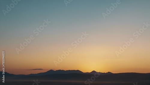 Sunrise over a misty mountain range, AI-generated.