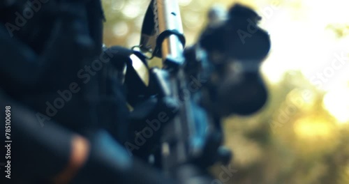 Armed Guard Patrolling with Military Equipment in Close-up photo