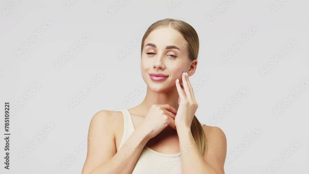 Concept for advertising cosmetics, beauty services and healthy skin. Young, beautiful woman with blue eyes and perfect skin touching her face with her hands, isolated on a white background. Concept for advertising cosmetics, beauty services and healthy skin. Young, beautiful woman with blue eyes and perfect skin touching her face with her hands, isolated on a white background.