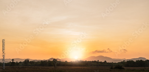 sunset sky in the evening over hill countryside 