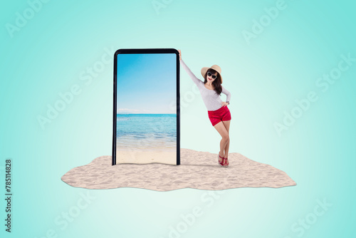 Asian woman in summer vacation trip standing next to a big 3d model of phone
