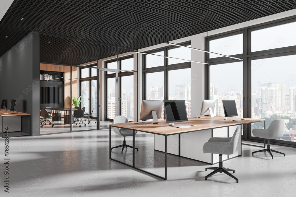 Stylish office interior with glass meeting room and coworking zone, window Stylish office interior with glass meeting room and coworking zone, window