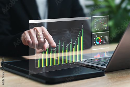 Digital marketing data analysis and Business management concept, Businesswomen use the tablet analysis chart strategic planning for sustainable development and financial and investment competition