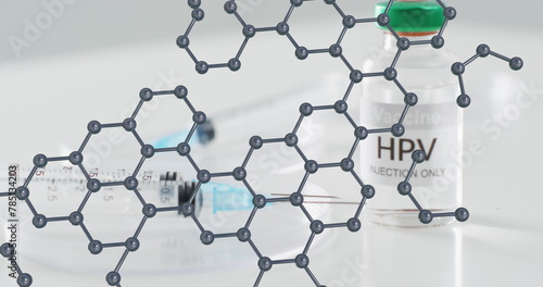 Molecular structure model over syringe and hpv vaccine vial photo