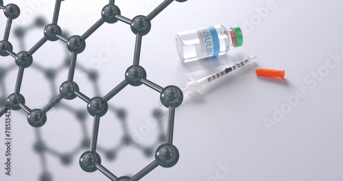 Molecular structure model over syringe and vaccine vial on white background