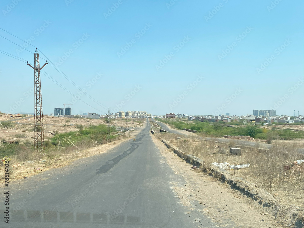 Beautiful curves on a rural road between deciduous forests near jodhpur rajasthan india, road between forest rajasthan travel,
View of the road in the valley between the mountains in jodhpur district 