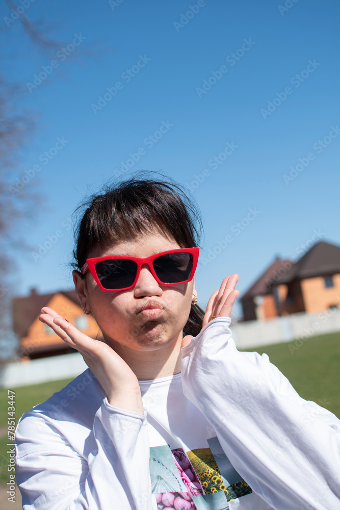 Portrait of a young woman in red sunglasses Portrait of a young woman in red sunglasses