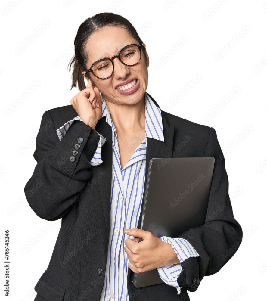 Professional young Caucasian businesswoman with laptop on studio background covering ears with hands.