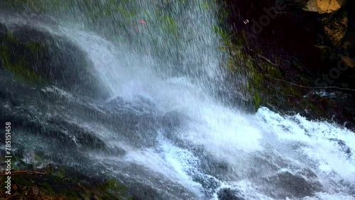 Giessbach Waterfall in a Sunny Summer Day in Giessbach, Brienz, Bernese Oberland, Bern Canton, Switzerland. Slow Motion) photo
