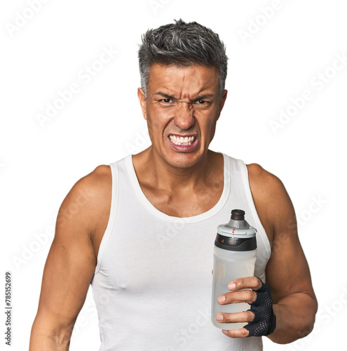 Gym-ready Hispanic man with water bottle screaming very angry and aggressive.