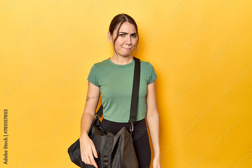 Athletic caucasian woman with sports backpack confused, feels doubtful and unsure. Athletic caucasian woman with sports backpack confused, feels doubtful and unsure.