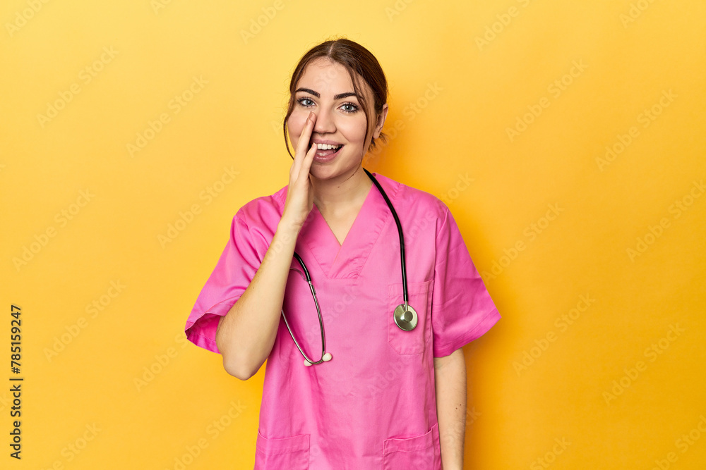 Nursing assistant in yellow background shouting and holding palm near opened mouth. Nursing assistant in yellow background shouting and holding palm near opened mouth.