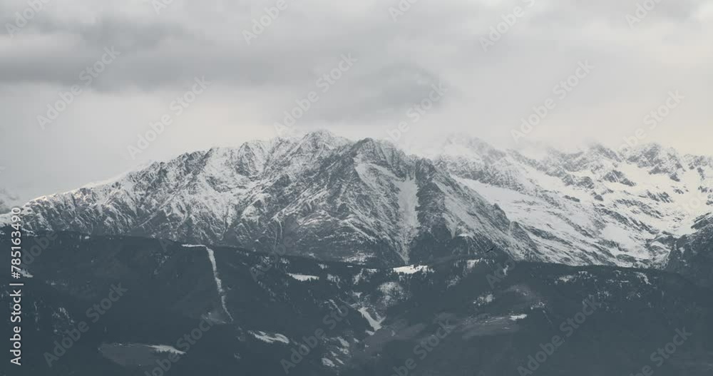 Beautiful shot of snowy mountains on a cloudy day Beautiful shot of snowy mountains on a cloudy day
