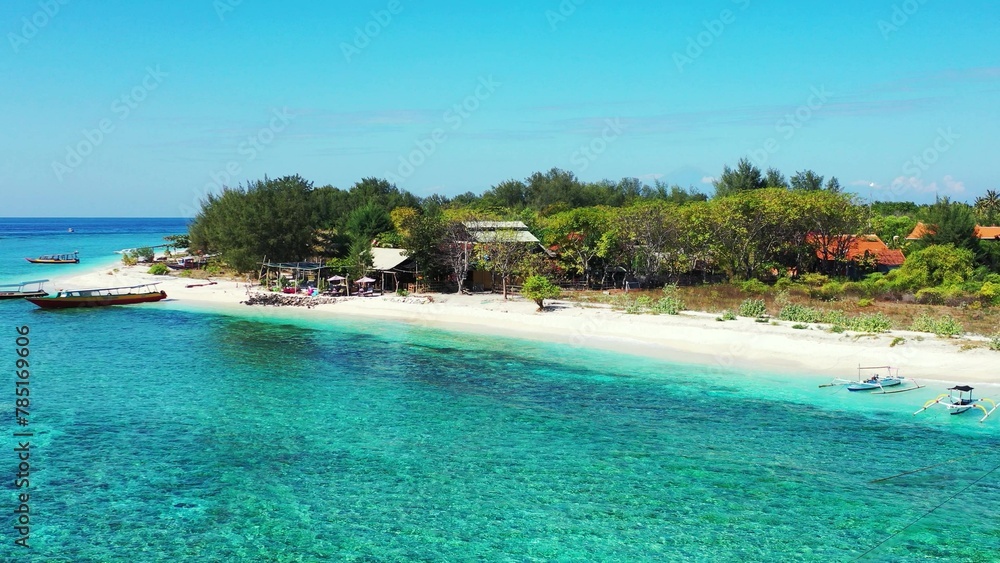 Fototapeta premium Boats and catamarans parked by a sandy beach
