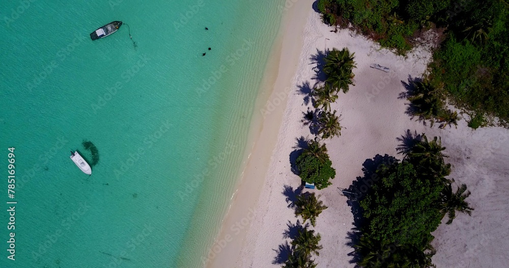 Aerial view of boats parked near a sandy beach