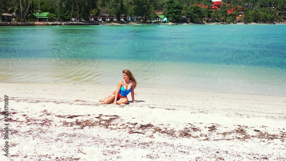 Sexy caucasian female sitting on a sandy coastline in Koh Phangan, Thailand Sexy caucasian female sitting on a sandy coastline in Koh Phangan, Thailand