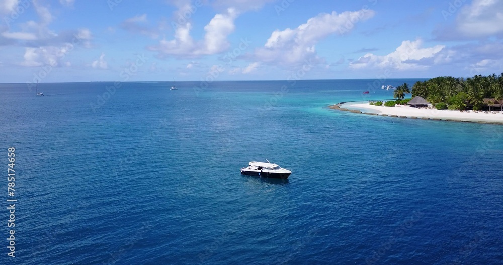 Aerial shot of a ship on a blue calm water