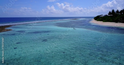 Bird's-eye view of a tropical island in the azure ocean