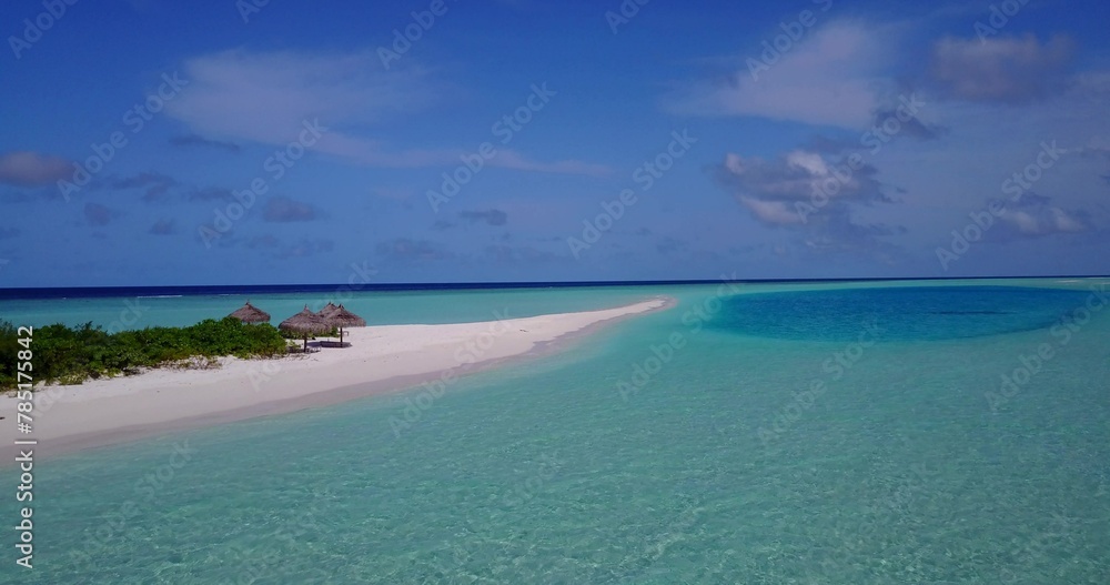 Aerial view of a small island with trees in the middle of the ocean Aerial view of a small island with trees in the middle of the ocean