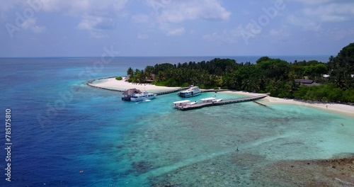 Aerial view of boats docking at a jetty near an island