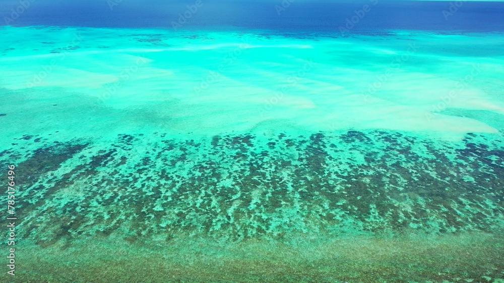 Fototapeta premium Bird's eye view of the azure water of the ocean in Asia