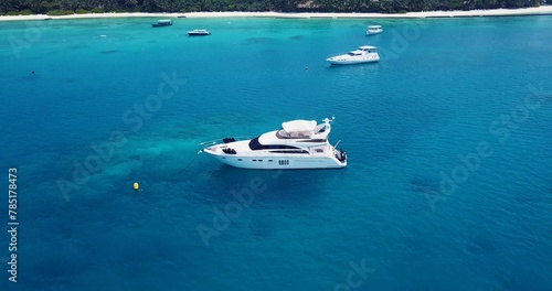 Beautiful view of a boat in a calm blue sea on a sunny day © Wirestock