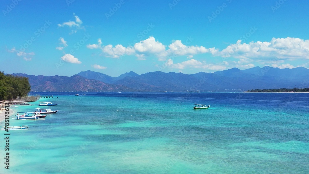 Beautiful view of a seascape with boats under a blue sky in Asia