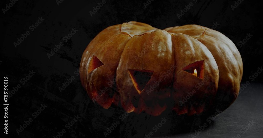Obraz premium Image of jack o lantern halloween pumpkin on black background