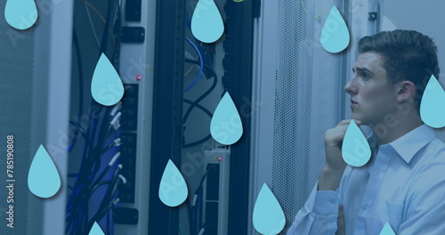 Image of drop icons over caucasian male worker inspecting server room photo