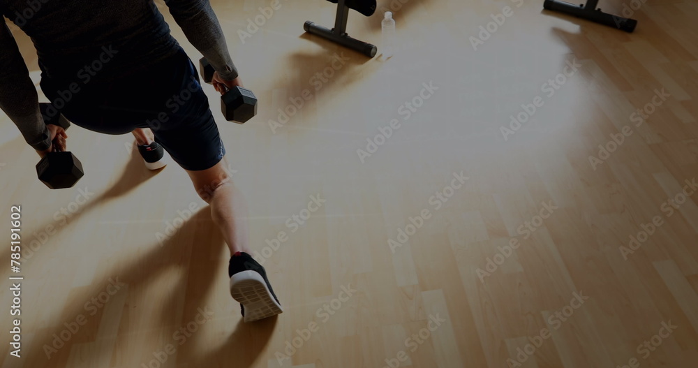 Obraz premium Image of graphs and financial data over midsection of caucasian man exercising with weights