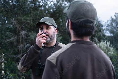 Canvas Print Man talking with walkie talkie radio - Park Ranger Team for Wildfire Prevention
