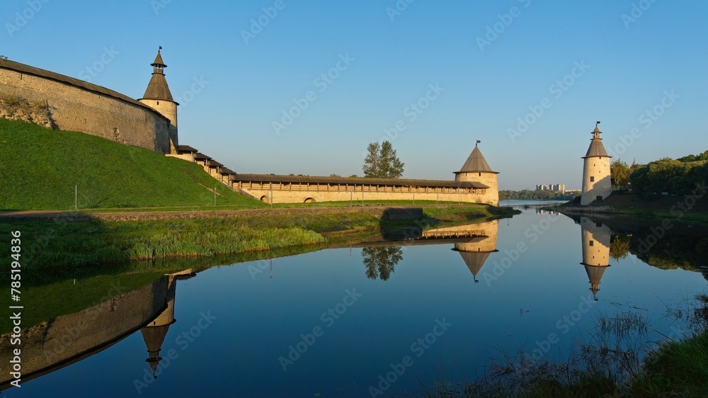 Pskov, Russia, September 11, 2023. The fortress moat near the Kremlin walls at dawn.                               - obrazy, fototapety, plakaty 