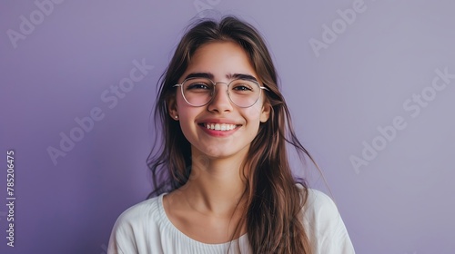 A cheerful young student girl, in a professional headshot, against a solid lavender background, exuding confidence