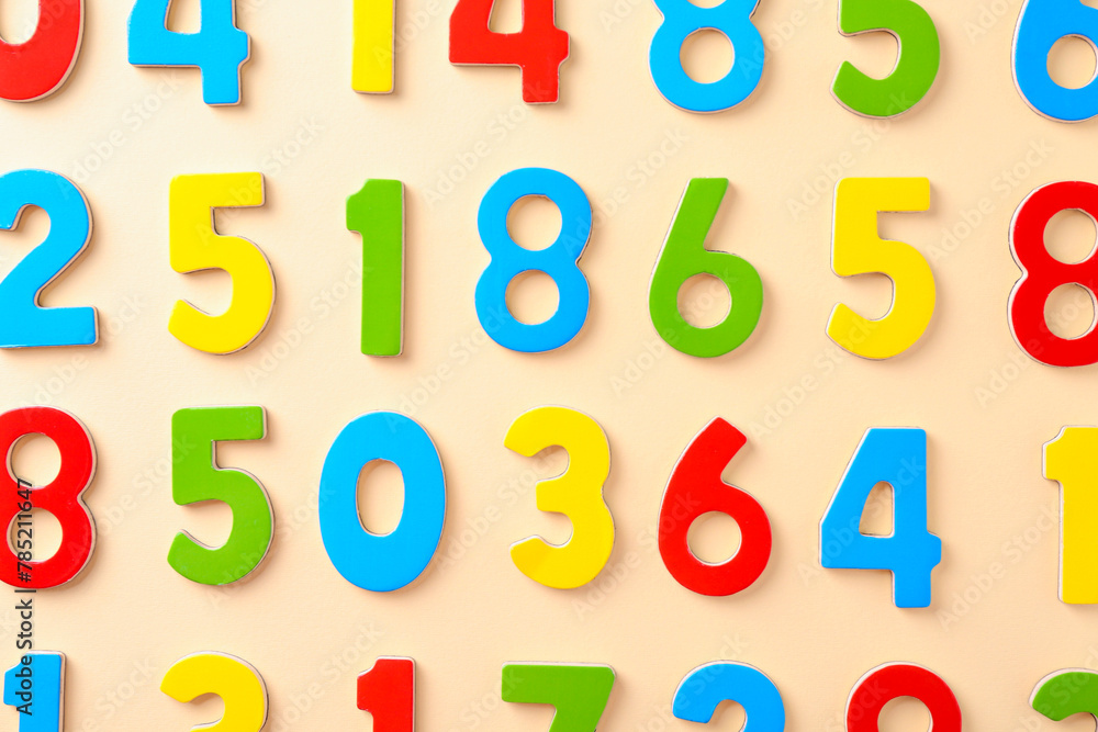 Colorful numbers on beige background, flat lay Colorful numbers on beige background, flat lay