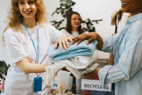 young people are engaged in charity and volunteering, select clothes for recycling, environmental volunteers