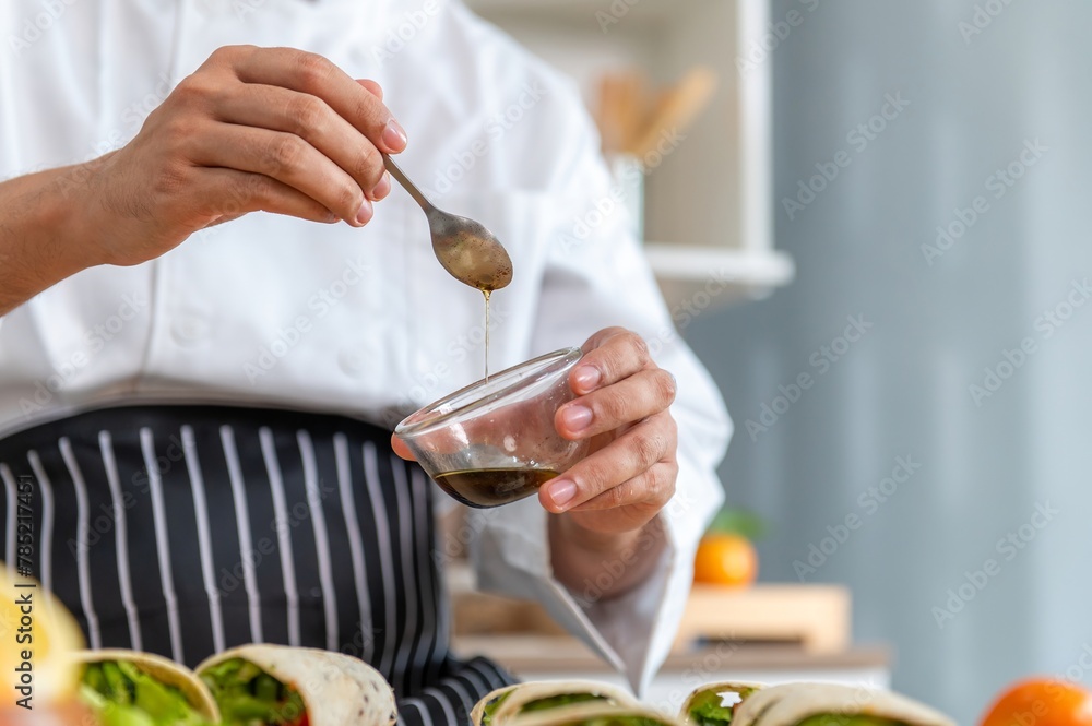 chef make tortilla wrap vegetable salad slice by knife on cutting board and mix sour salad dressing in small bowl glass with wine and olive oil. tortillas wrap vegetable and juicy liquid sour dressing chef make tortilla wrap vegetable salad slice by knife on cutting board and mix sour salad dressing in small bowl glass with wine and olive oil. tortillas wrap vegetable and juicy liquid sour dressing