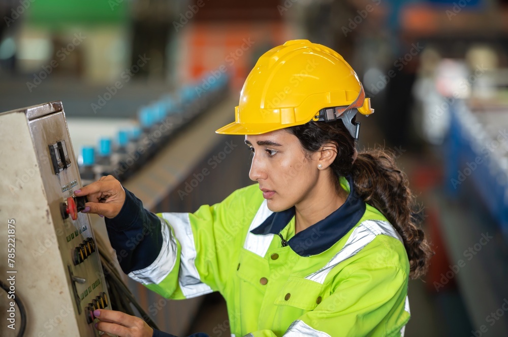 young woman engineer in uniform inspection warehouse and check control heavy machine construction installation in industrial factory. technician worker check for repair maintenance operation system young woman engineer in uniform inspection warehouse and check control heavy machine construction installation in industrial factory. technician worker check for repair maintenance operation system
