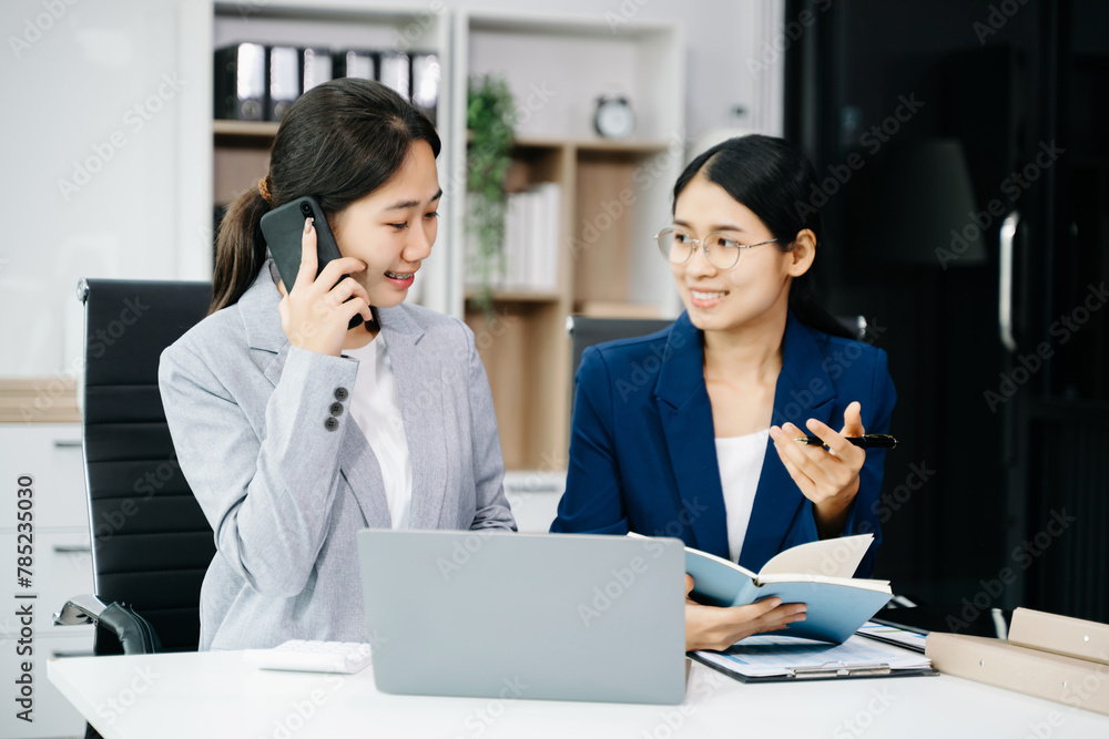 Kind leader executive manager share and discuss business solutions plan ideas on tablet with Asian female marketing manager. Kind leader executive manager share and discuss business solutions plan ideas on tablet with Asian female marketing manager.