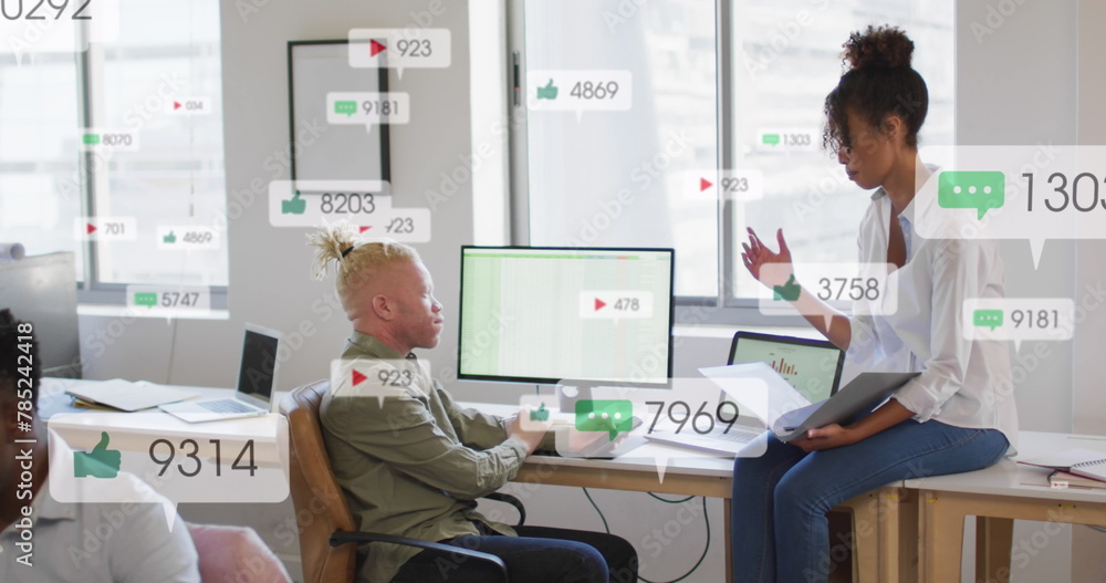 Obraz premium Image of multiple notification bars over diverse coworkers discussing reports on computer